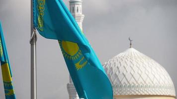 Flag of Republic of Kazakhstan on the background dome of the mosque. video