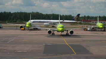 MOSCOW, RUSSIAN FEDERATION JULY 24, 2021 - Airplane of S7 Airlines taxiing to the terminal of Domodedovo airport. Aviation Traffic. Singapore Airlines plane at the airport video