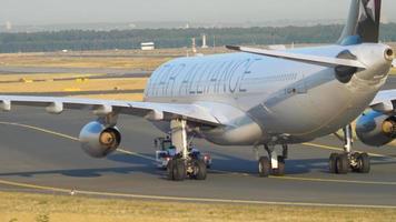 FRANKFURT AM MAIN, GERMANY JULY 21, 2017 - Lufthansa Airbus 340 D AIGP, Star Alliance livery towing to service. Fraport, Frankfurt, Germany video