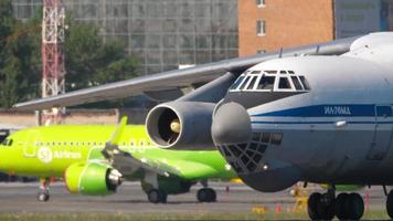 NOVOSIBIRSK, RUSSIAN FEDERATION JUNY 12, 2022 - Heavy transport aircraft of IL 76 taxiing at Tolmachevo airport. Il 76 Soviet military transport aircraft video