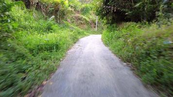 Riding up the hill follow asphalt road. video