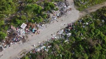 Aerial fly rotation rural path with rubbish dump video