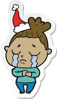 sticker cartoon of a crying woman wearing santa hat vector