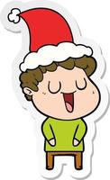 laughing sticker cartoon of a man wearing santa hat vector