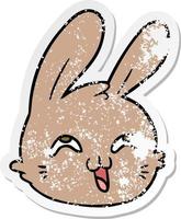 distressed sticker of a cartoon happy rabbit face vector