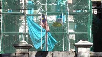 Malaysia flag and Penang state flag at old heritage building at Georgetown video