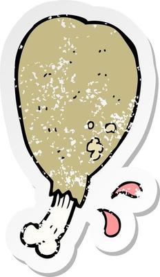 retro distressed sticker of a cartoon chicken leg