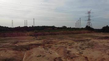 Electric tower near land clearing video