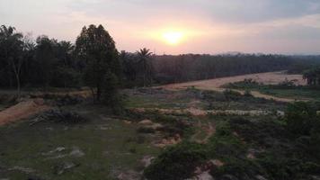 Drone view sunset over land clearing video