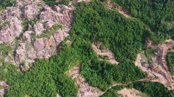 Aerial view red clay soil after mining near forest video