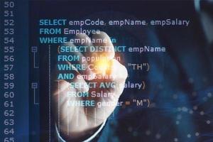 System analyst or businessman coding SQL Structured Query Language code. Example of SQL code to query data from a database. photo