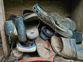 Picture of a pile of broken shoes photo