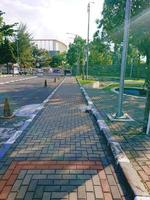 Picture of a street scene with lampposts lined up photo