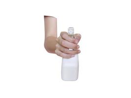 woman hand, hold bottle spraying water photo
