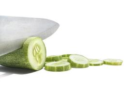 Cutting Fresh Green Cucumber isolated on white background photo
