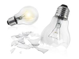 Broken light bulb isolated on white background photo