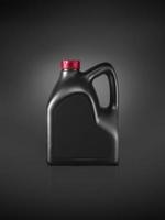 Gallon of engine oil on a dark black background photo