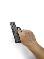 Hands holding gun isolated on white background photo