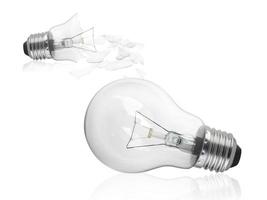 Broken light bulb isolated on white background photo