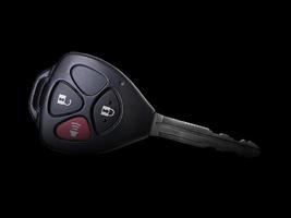 Remote car key isolated on black background photo