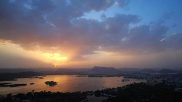 Evening view of Udaipur city skyline and lake Pichola time lapse 4K footage seen from Udaipur view point. video