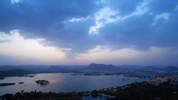 Evening view of Udaipur city skyline and lake Pichola time lapse. video