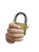 Metal padlock in hand isolated on white background photo