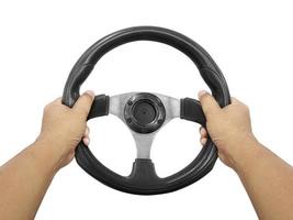 Hands holding steering wheel isolated on white photo