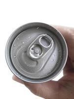 Top view. a man hand holds a cans isolated on white background photo