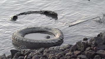 Abandoned old tire in mud video