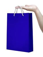 paper bag on human hands. isolated on a white background photo