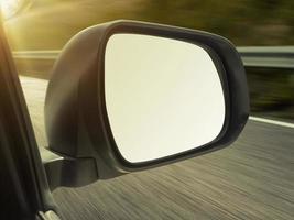 view mirrors in cars at the setting sun, blurred landscape photo