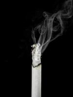 The cigarette isolated on a white background photo