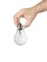 hand holding light bulb isolated on white background photo