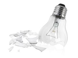 Broken light bulb isolated on white background photo