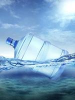 Plastic big water bottles in ocean photo