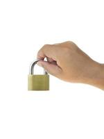 Metal padlock in hand isolated on white background photo