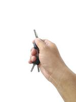 Hand with a car key. Isolated on white background photo