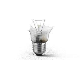 Broken old light bulb isolated on white background photo