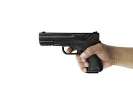 Hands holding gun isolated on white background photo