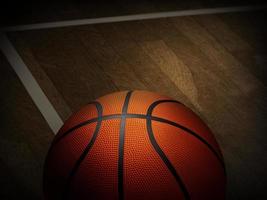 Basketball on wooden floor photo