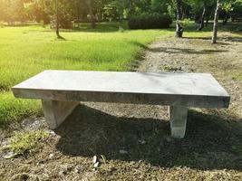 Wooden bench in garden photo