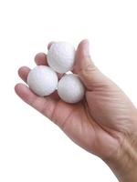 Man's hand holding three white blank styrofoam ball against the white background3 photo