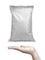 Foil food package mockup in hand on white isolation background photo