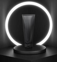 Black plastic cosmetic tube for cream or gel mockup, Neon glass ring background. 3D render photo