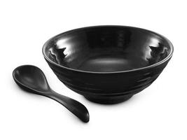 spoon and black ceramic bowl isolated on white background photo