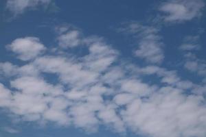 Blue sky white clouds background photo