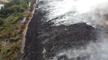 Aerial view fire burn at garbage dump video