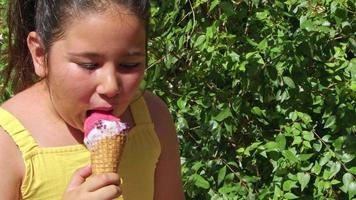 Little Girl Smiling Looking At Camera While Eating Ice Cream video