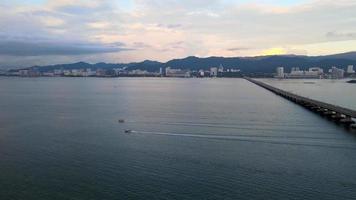 Aerial view three boats move near Penang Bridge video